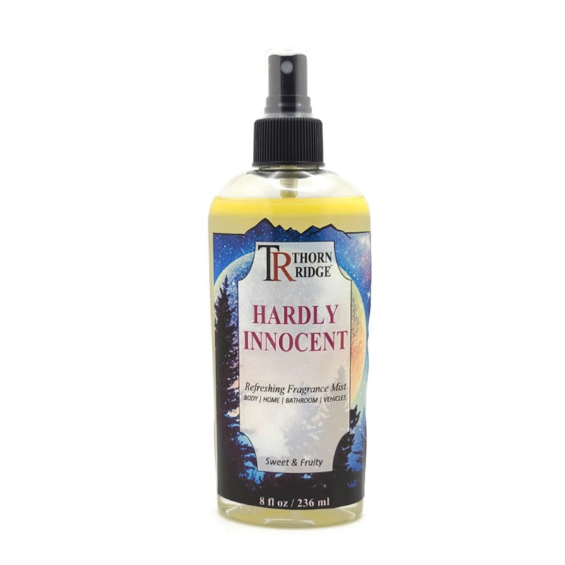 A bottle of Thorn Ridge fragrance mist labeled "Hardly Innocent," described as a sweet and fruity scent for body, home, bathroom, and vehicles. 8 fl oz.