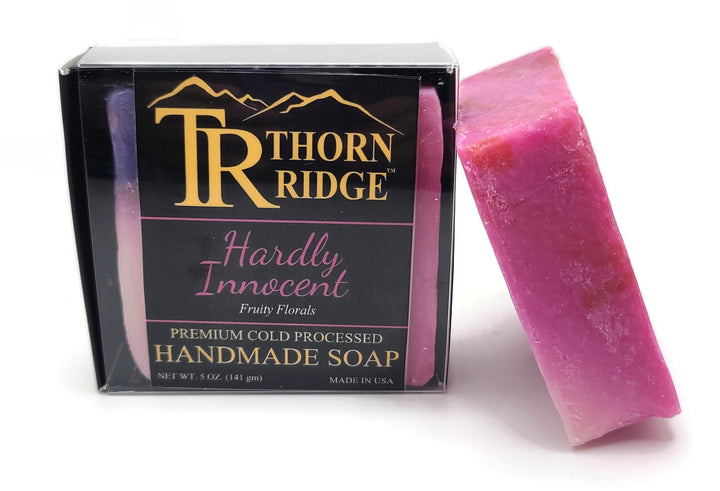 Packaging of Thorn Ridge soap labeled "Hardly Innocent" described as fruity florals, premium cold processed, handmade, 5 oz. Made in USA.