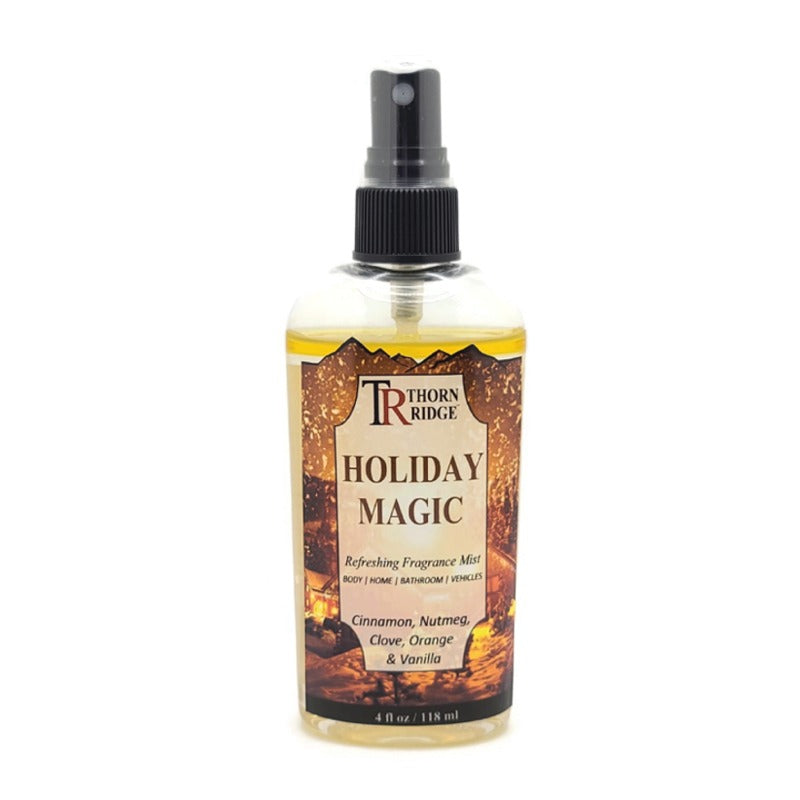 A bottle of Thorn Ridge fragrance mist labeled "Holiday Magic," described as a cinnamon, nutmeg, clove, orange, and vanilla scent for body, home, bathroom, and vehicles. 4 fl oz.