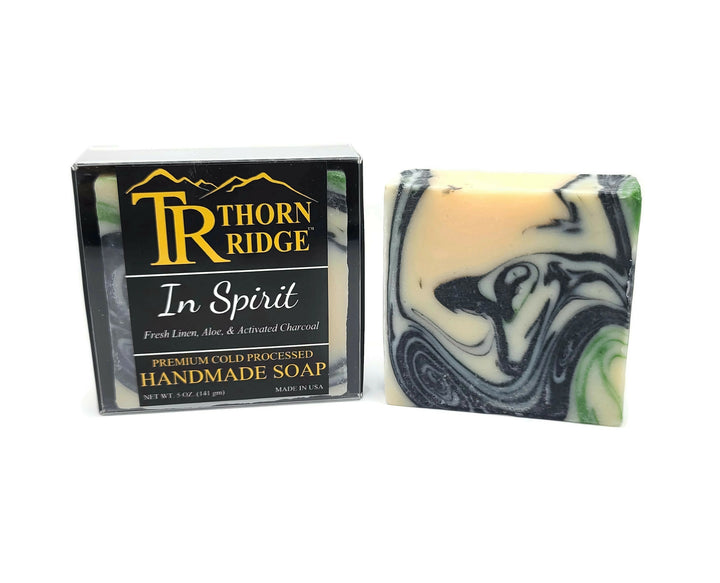 Packaging of Thorn Ridge soap labeled "In Spirit," described as fresh linen, aloe, activated charcoal, premium cold processed, handmade, 5 oz. Made in USA.