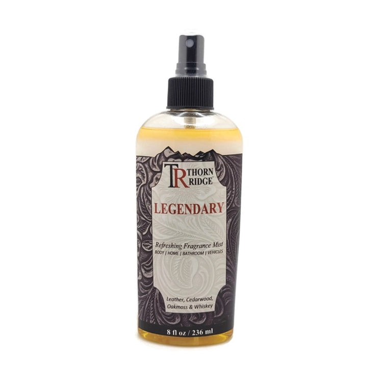 A bottle of Thorn Ridge fragrance mist labeled "Legendary," described as a leather, cedarwood, oakmoss and whiskey scent for body, home, bathroom, and vehicles. 8 fl oz.