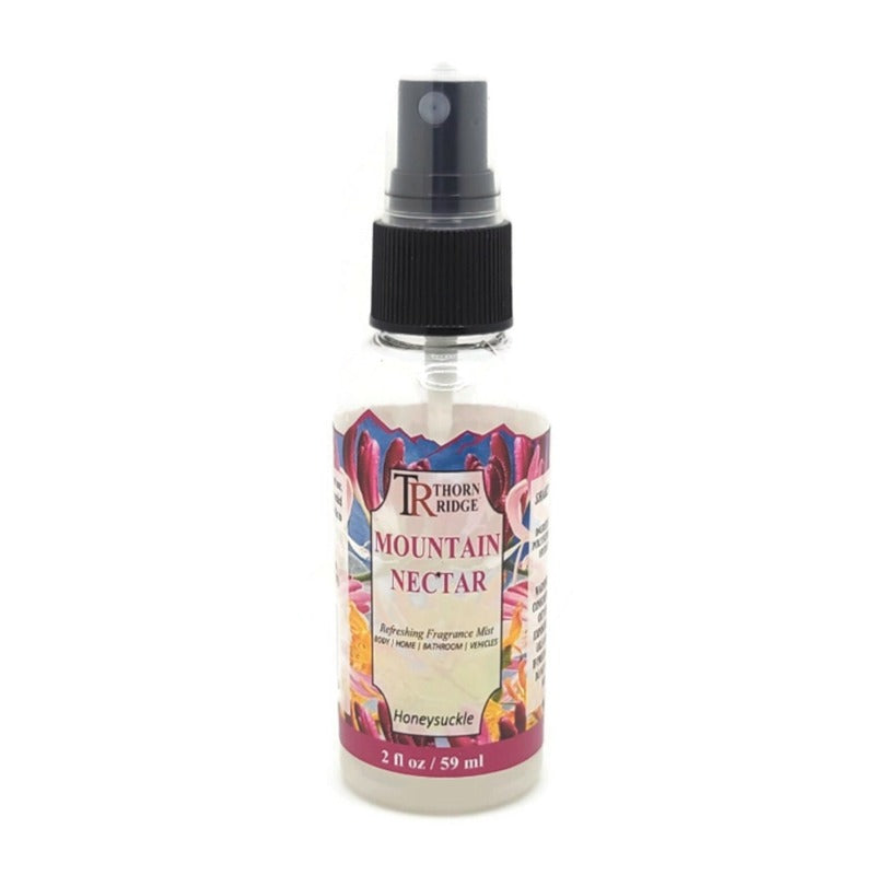 A bottle of Thorn Ridge fragrance mist labeled "Mountain Nectar," described as a honeysuckle scent for body, home, bathroom, and vehicles. 2 fl oz.