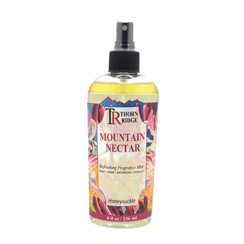 A bottle of Thorn Ridge fragrance mist labeled "Mountain Nectar," described as a honeysuckle scent for body, home, bathroom, and vehicles. 8 fl oz.