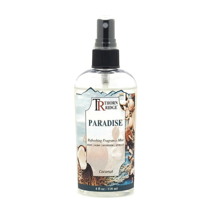 A bottle of Thorn Ridge fragrance mist labeled "Paradise," described as a coconut scent for body, home, bathroom, and vehicles. 8 fl oz.