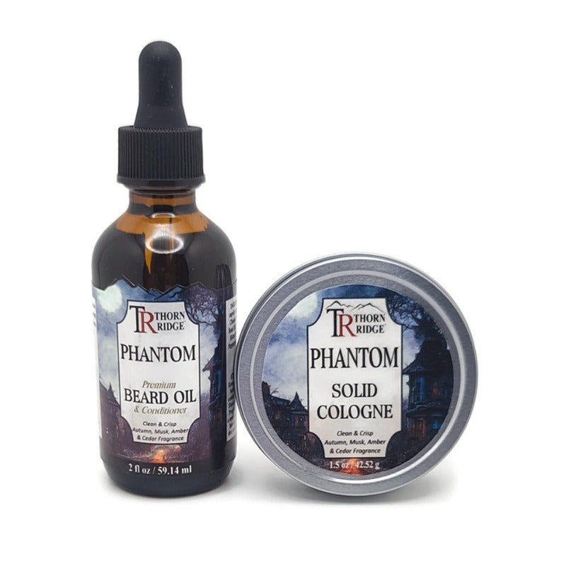 Packaging of Thorn Ridge gift set containing a 2 oz bottle of beard oil and a 1.5 oz tin can of solid cologne described as a clean and crisp autumn, musk, amber and cedar  fragrance and labeled "Phantom," Made in USA.