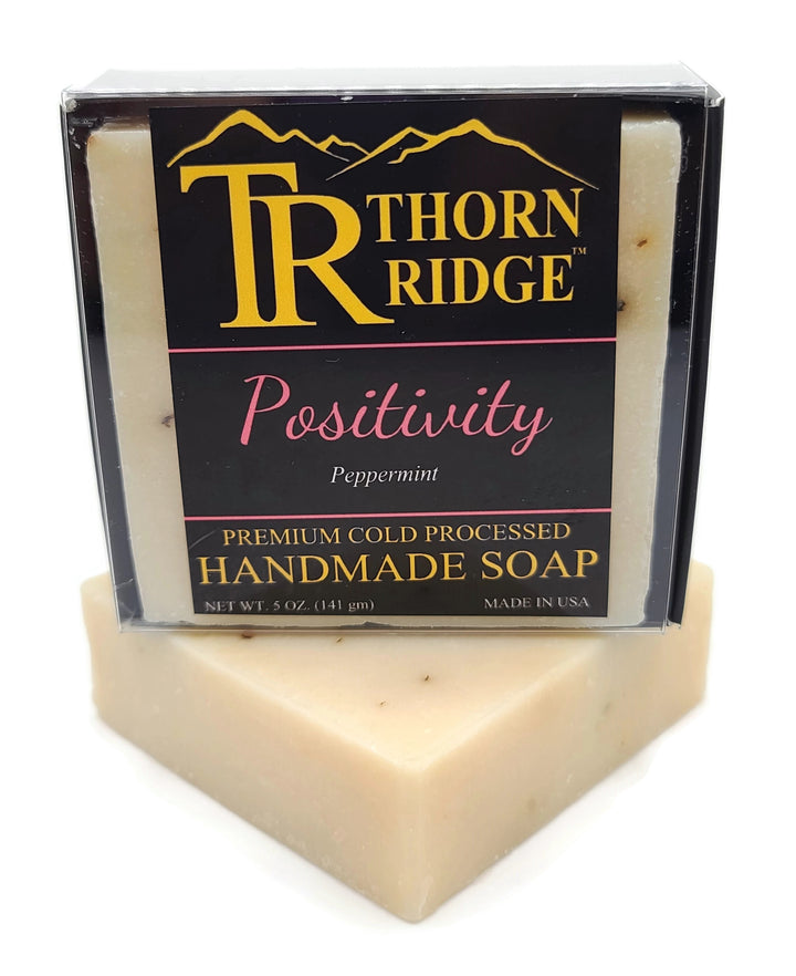 Packaging of Thorn Ridge soap labeled "Positivity," described as peppermint, premium cold processed, handmade, 5 oz. Made in USA.