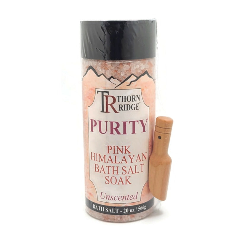 A container of Thorn Ridge fragrance mist labeled "Purity" described as a unscented pink himalayan bath salt soak with a shaker top. 20 oz.