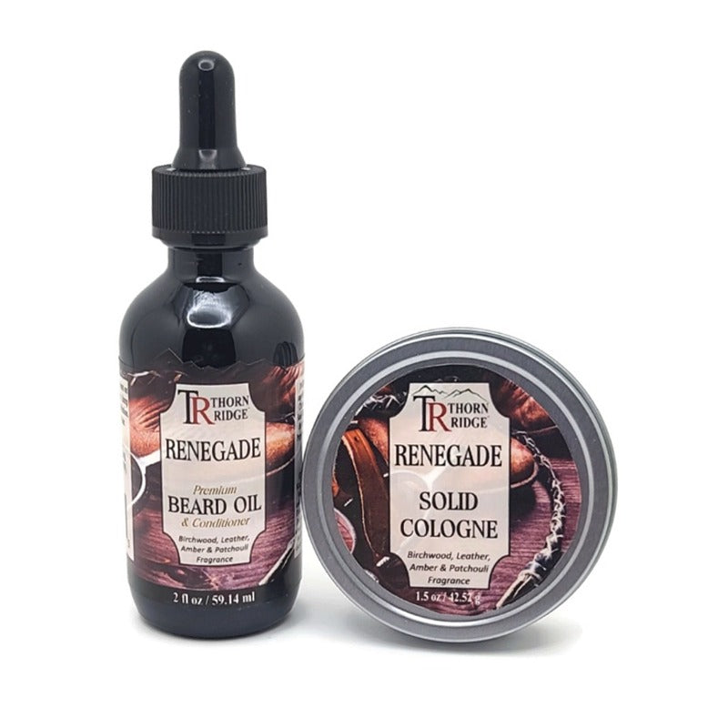 Packaging of Thorn Ridge gift set containing a 2 oz bottle of beard oil and a 1.5 oz tin can of solid cologne described as a birchwood, leather, amber, and patchouli fragrance and labeled "Renegade," Made in USA.