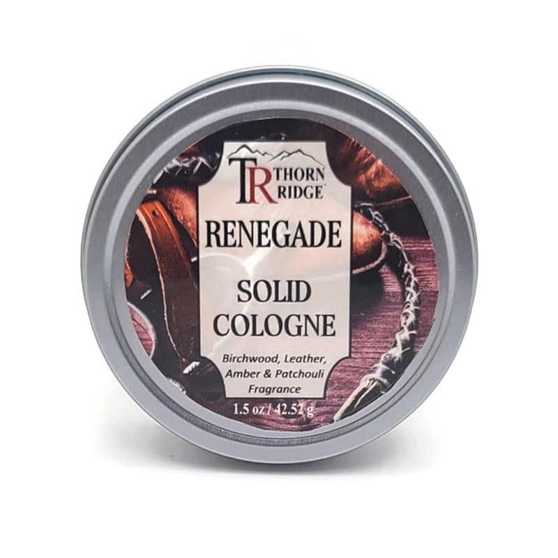 A silver tin of Thorn Ridge solid cologne labeled "Renegade," described as a birchwood, leather, amber, and patchouli fragrance. 1.5 oz.