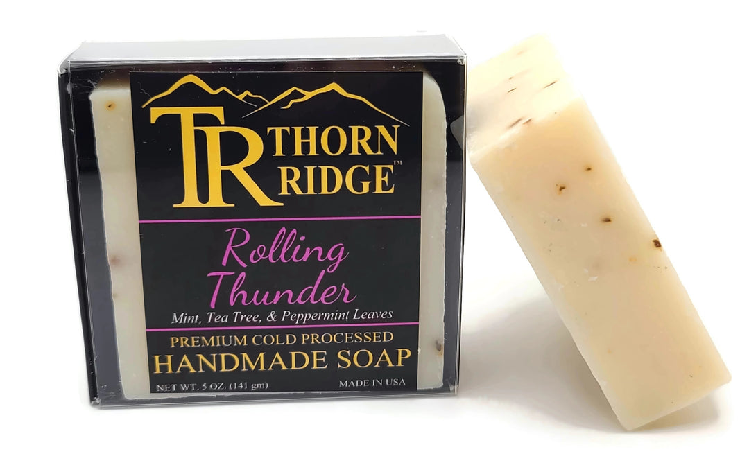 Packaging of Thorn Ridge soap labeled "Rolling Thunder," described as mint, tea tree, and peppermint leaves, premium cold processed, handmade, 5 oz. Made in USA.