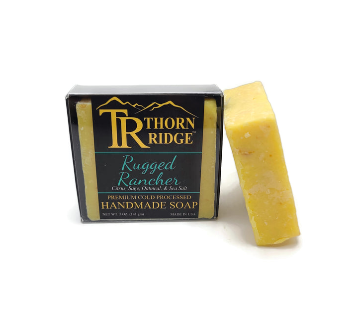 Packaging of Thorn Ridge soap labeled "Rugged Rancher," described as citrus, sage, oatmeal, sea salt, premium cold processed, handmade, 5 oz. Made in USA.