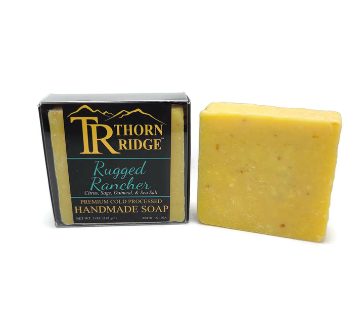 Packaging of Thorn Ridge soap labeled "Rugged Rancher," described as citrus, sage, oatmeal, sea salt, premium cold processed, handmade, 5 oz. Made in USA.