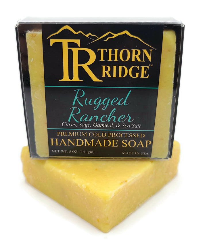 Packaging of Thorn Ridge soap labeled "Rugged Rancher," described as citrus, sage, oatmeal, sea salt, premium cold processed, handmade, 5 oz. Made in USA.