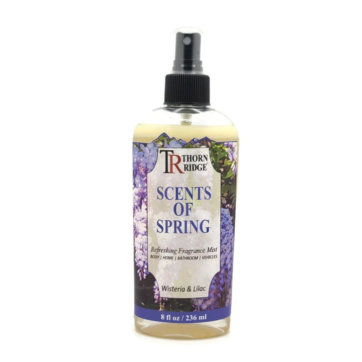 A bottle of Thorn Ridge fragrance mist labeled "Scents Of Spring," described as a wisteria and lilac  scent for body, home, bathroom, and vehicles. 8 fl oz.