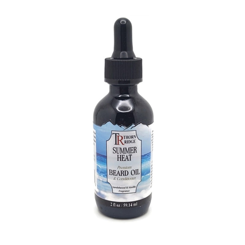 A bottle of Thorn Ridge beard oil labeled "Summer Heat," described as a premium beard oil and conditioner with a sandalwood and vanilla fragrance. 2 fl oz.