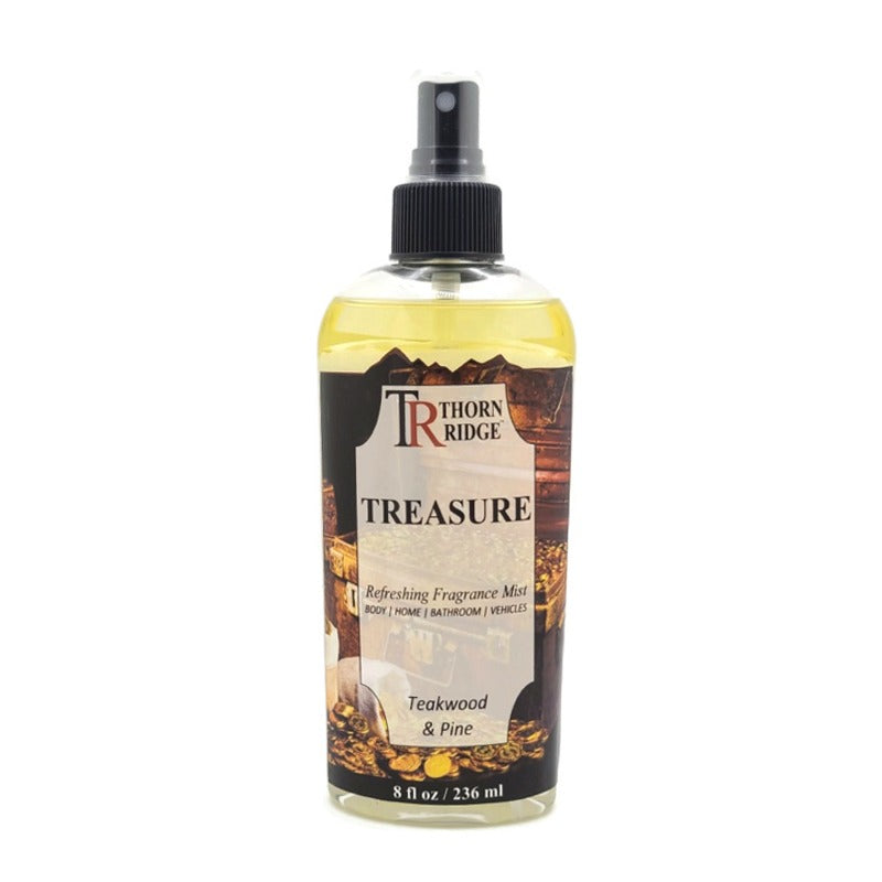 A bottle of Thorn Ridge fragrance mist labeled "Treasure," described as a teakwood and pine scent for body, home, bathroom, and vehicles. 8 fl oz.