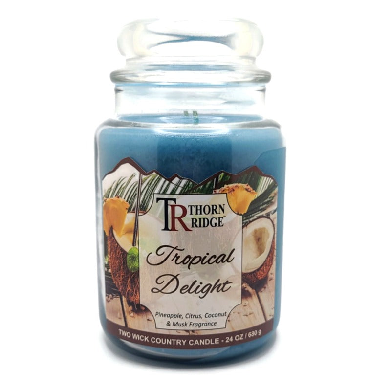 Thorn Ridge country candle labeled "Tropical Delight," described as a pineapple, citrus, coconut and musk fragrance, 2 Wick, 24 oz.