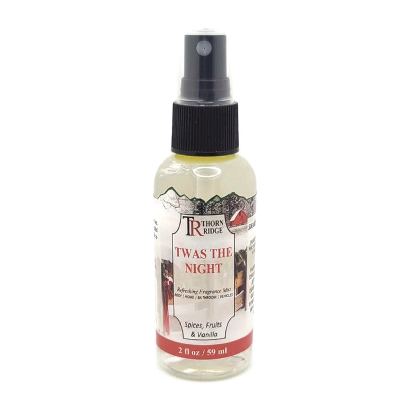 A bottle of Thorn Ridge fragrance mist labeled "Twas The Night," described as a spices, fruits, and vanilla scent for body, home, bathroom, and vehicles. 2 fl oz.