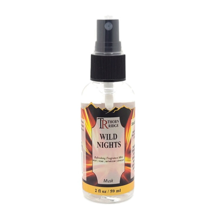 A bottle of Thorn Ridge fragrance mist labeled "Wild Nights," described as a musk scent for body, home, bathroom, and vehicles. 2 fl oz.