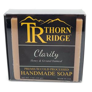 Packaging of Thorn Ridge soap labeled "Clarity," described as honey and ground oatmeal, premium cold processed, handmade, 5 oz. Made in USA.