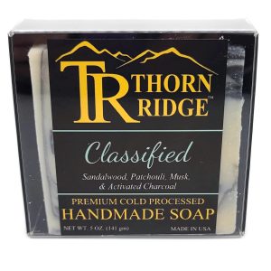 Packaging of Thorn Ridge soap labeled "Classified," described as sandalwood, patchouli, musk, and activated charcoal, premium cold processed, handmade, 5 oz. Made in USA.