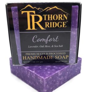 Packaging of Thorn Ridge soap labeled "Comfort," described as lavender, oak moss, sea salt, premium cold processed, handmade, 5 oz. Made in USA.