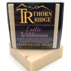 Packaging of Thorn Ridge soap labeled "Exotic Wilderness," described as patchouli, lavender, exotic florals and fruits, premium cold processed, handmade, 5 oz. Made in USA.
