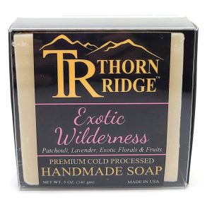 Packaging of Thorn Ridge soap labeled "Exotic Wilderness," described as patchouli, lavender, exotic florals and fruits, premium cold processed, handmade, 5 oz. Made in USA.
