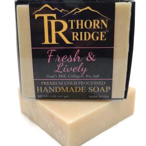 Packaging of Thorn Ridge soap labeled "Fresh and Lively" described as goat's milk, collagen, sea salt, premium cold processed, handmade, 5 oz. Made in USA.