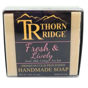 Packaging of Thorn Ridge soap labeled "Fresh and Lively" described as goat's milk, collagen, sea salt, premium cold processed, handmade, 5 oz. Made in USA.