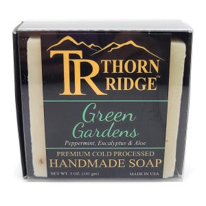 Packaging of Thorn Ridge soap labeled "Green Gardens," described as peppermint, eucalyptus, aloe, premium cold processed, handmade, 5 oz. Made in USA.