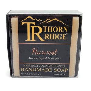 Packaging of Thorn Ridge soap labeled "Harvest," described as avocado, sage, lemongrass, premium cold processed, handmade, 5 oz. Made in USA.