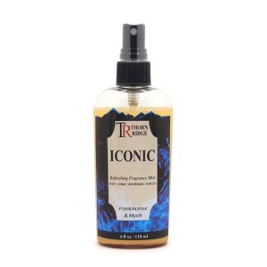 A bottle of Thorn Ridge fragrance mist labeled "Iconic," described as a frankincense and myrrh scent for body, home, bathroom, and vehicles. 4 fl oz.