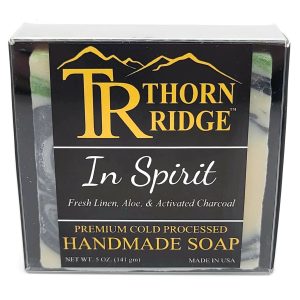 Packaging of Thorn Ridge soap labeled "In Spirit," described as fresh linen, aloe, activated charcoal, premium cold processed, handmade, 5 oz. Made in USA.