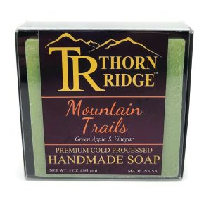 Packaging of Thorn Ridge soap labeled "Mountain Trails," described as green apple and vinegar, premium cold processed, handmade, 5 oz. Made in USA.