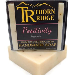 Packaging of Thorn Ridge soap labeled "Positivity," described as peppermint, premium cold processed, handmade, 5 oz. Made in USA.