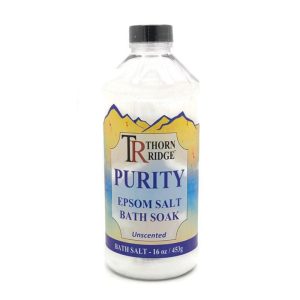 A bottle of Thorn Ridge foot soak labeled "Purity," described as an unscented epsom salt bath soak. 16 oz.