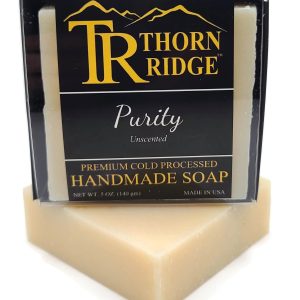 Packaging of Thorn Ridge soap labeled "Purity," described as unscented, premium cold processed, handmade, 5 oz. Made in USA.
