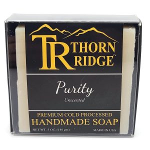 Packaging of Thorn Ridge soap labeled "Purity," described as unscented, premium cold processed, handmade, 5 oz. Made in USA.