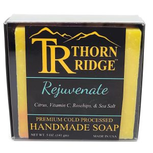 Packaging of Thorn Ridge soap labeled "Rejuvenate," described as citrus, vitamin C, rosehips, sea salt, premium cold processed, handmade, 5 oz. Made in USA.