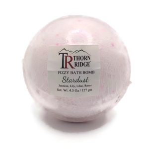 A Thorn Ridge fizzy bath bomb labeled "Stardust," described as a jasmine, lily, lilac, and roses fragrance. 4.5 oz.